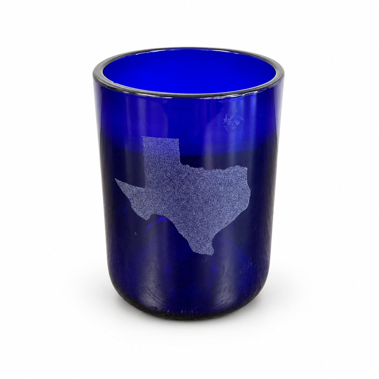 Cobalt blue glass tumbler featuring an etched Texas silhouette on the front