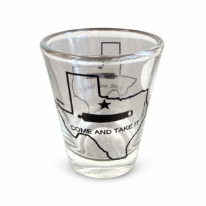 Clear shot glass featuring a Texas outline with black star, cannon, and Come and Take It design