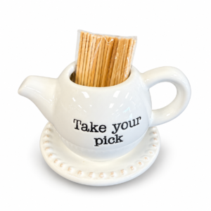 White ceramic toothpick holder shaped like a small pitcher with “Take Your Pick” lettering and matching beaded tray