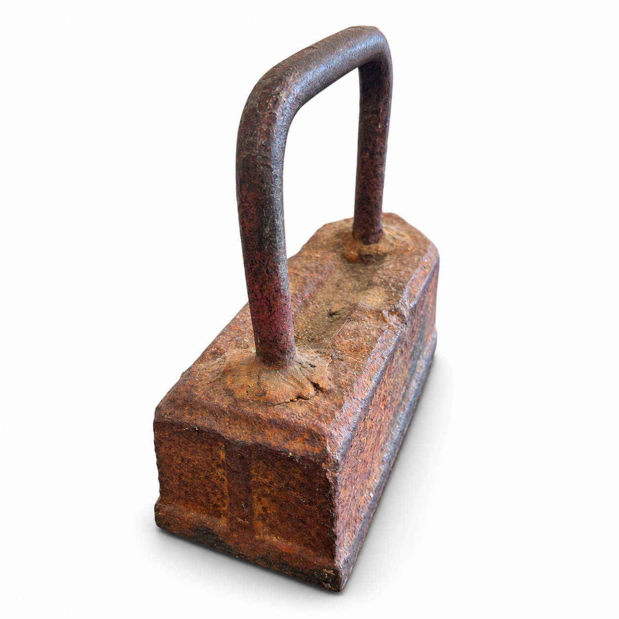 Vintage-style heavy metal sad iron with a tall handle and textured aged rust-brown finish.