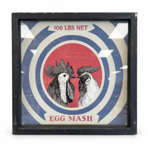 Vintage-style framed Egg Mash farm print featuring two roosters with red, blue, and cream graphics.