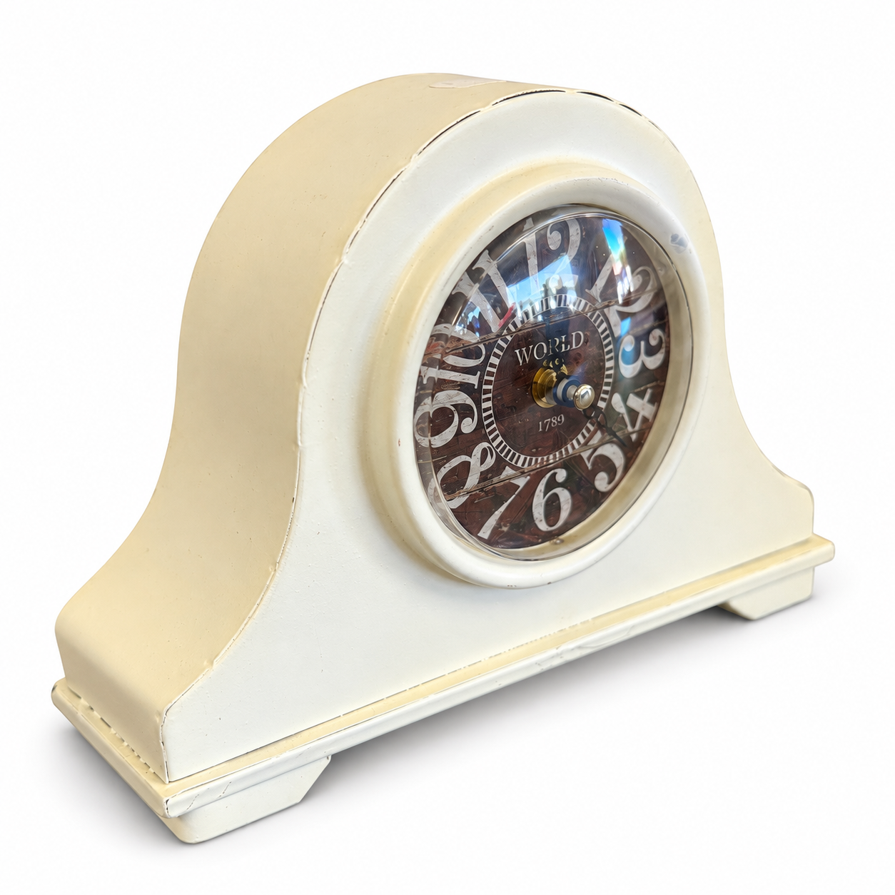 Vintage-style cream mantel clock with a distressed finish and decorative Roman numeral-inspired clock face.