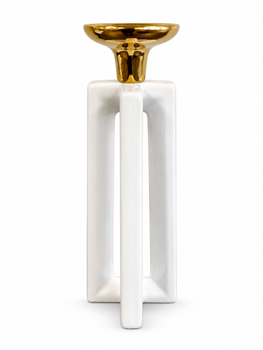 Modern white ceramic candle holder with an open geometric base and polished gold top.