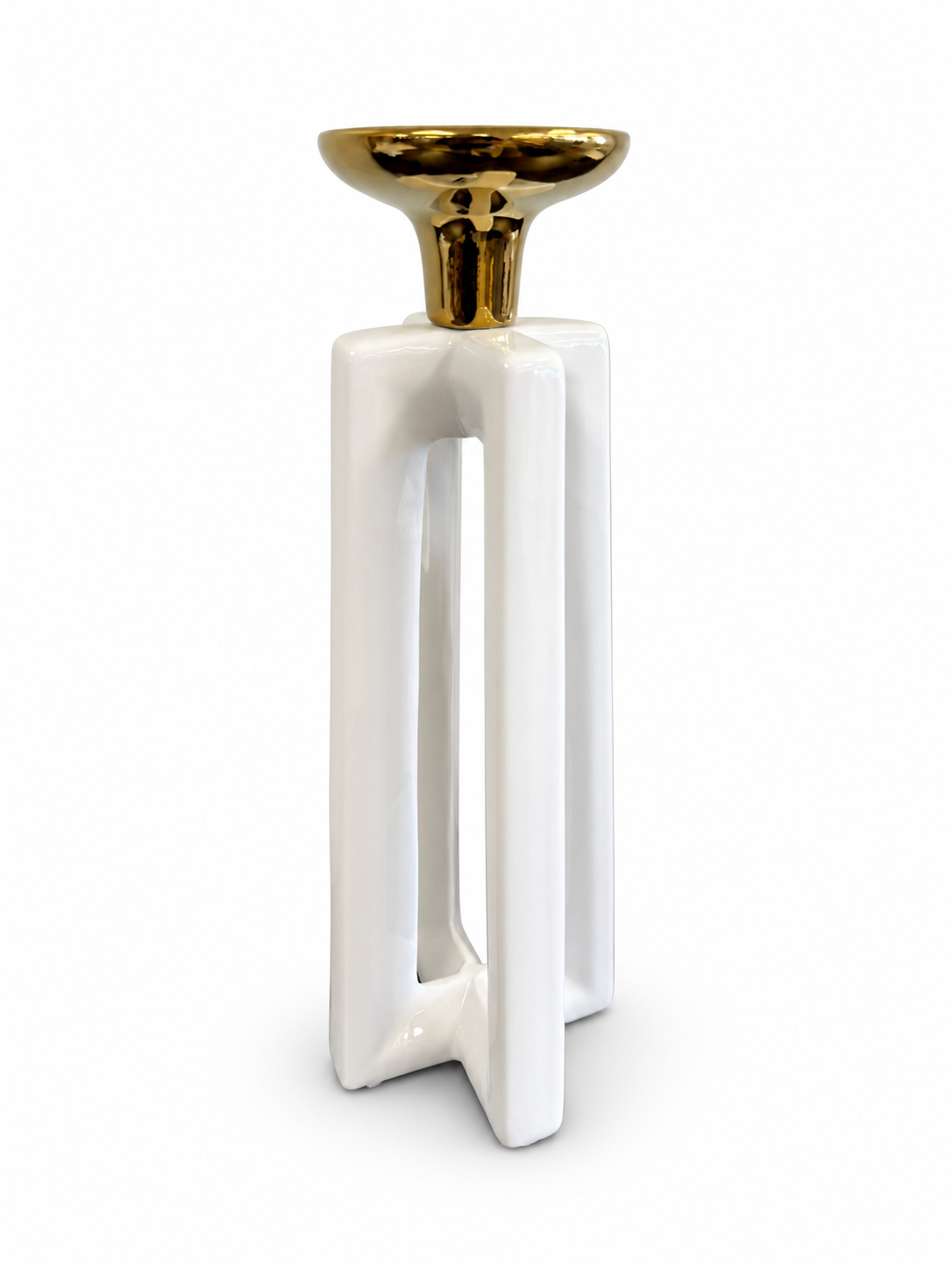 Modern white ceramic candle holder with an open geometric base and polished gold top.