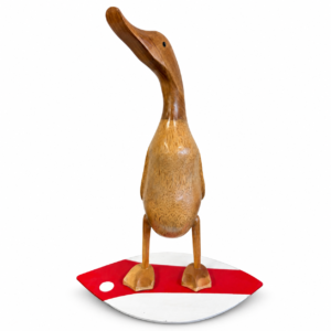 Handcrafted wooden duck sculpture standing on a red and white surfboard-style base.