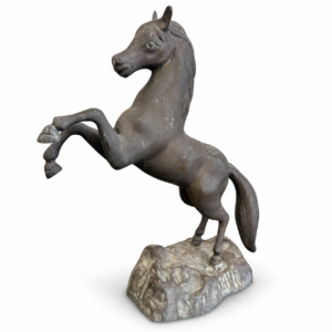Rearing horse decorative sculpture in a distressed dark finish standing on a textured base.