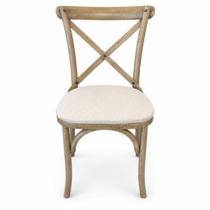 Natural wood cross-back dining chair with curved legs and light neutral upholstered seat