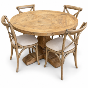 Round natural wood pedestal dining table with four cross-back chairs and light upholstered seats
