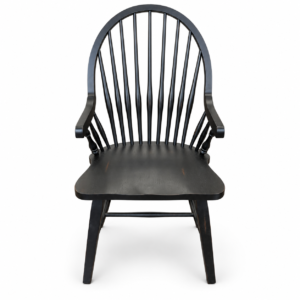 Black wooden Windsor dining armchair with tall arched spindle back, curved arms, and contoured seat