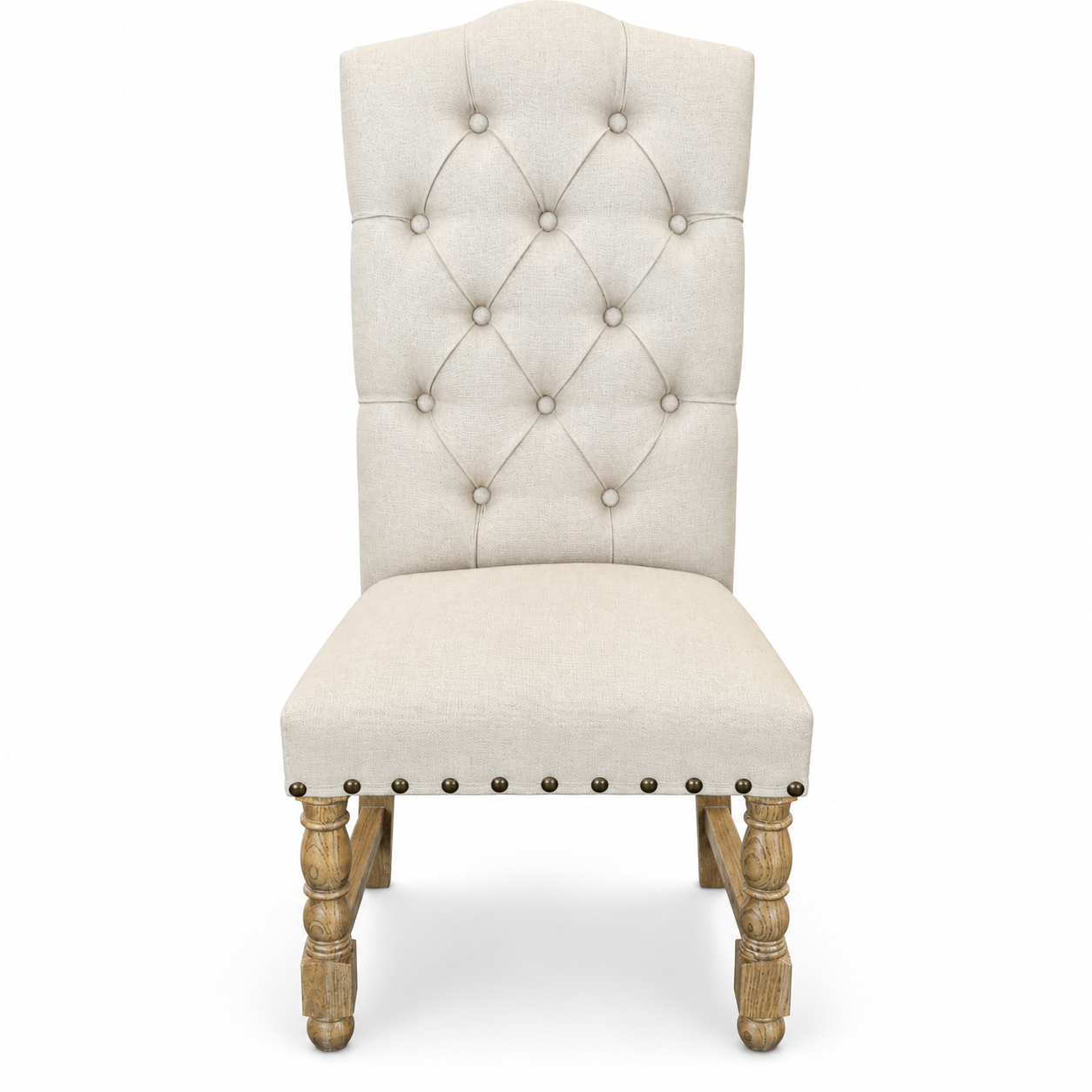 Cream upholstered high-back dining chair with button tufting, brass nailhead trim, and turned wood legs