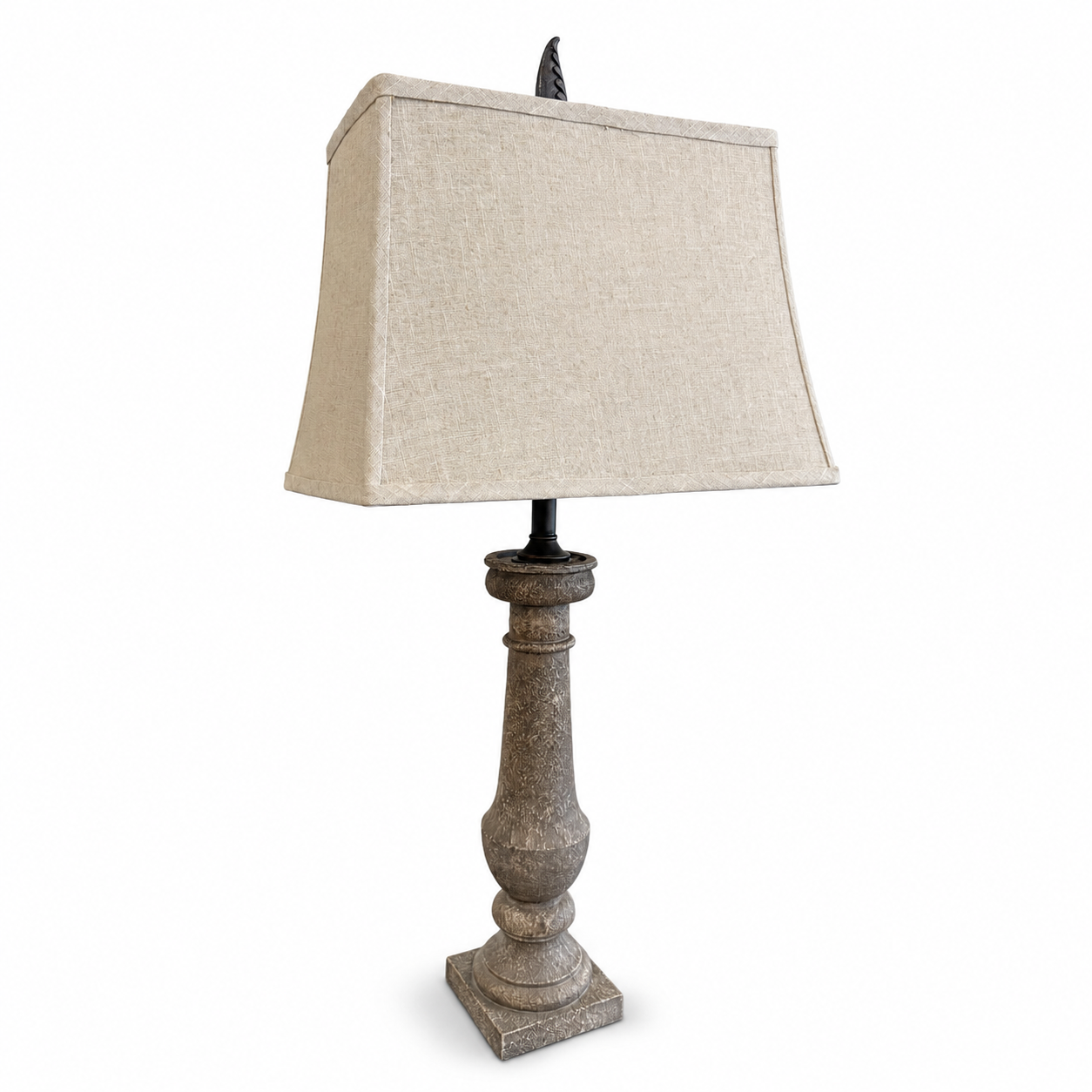 Rustic gray table lamp with distressed turned wood base and beige linen shade.
