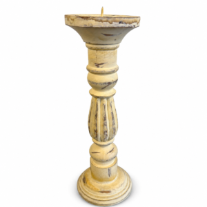 Tall vintage-style yellow candlestick holder with a distressed finish, turned details, fluted center, and round pedestal base on a white background.