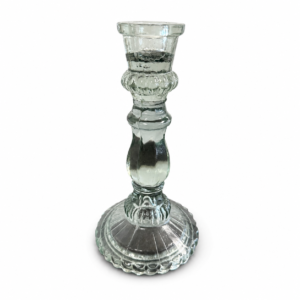 Clear glass pedestal candle holder with an ornate sculpted stem and decorative round base.