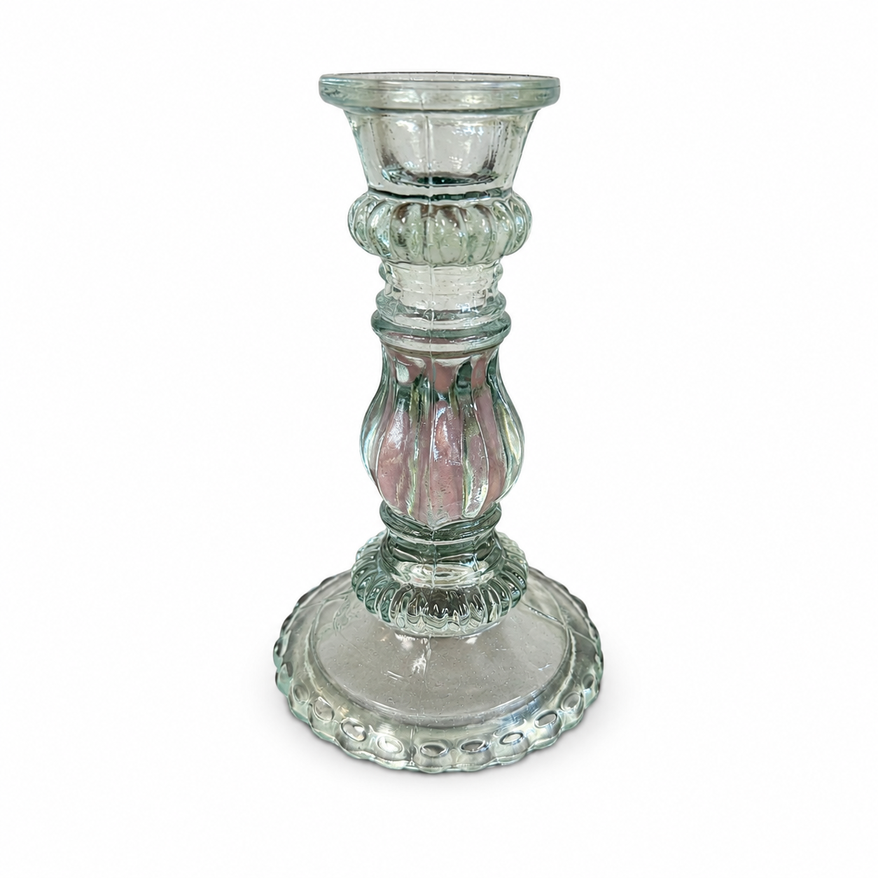 Clear glass pedestal candle holder with an ornate sculpted stem and decorative round base.