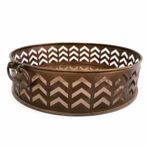 Round bronze metal decorative tray with chevron cutout pattern and rustic side handles.