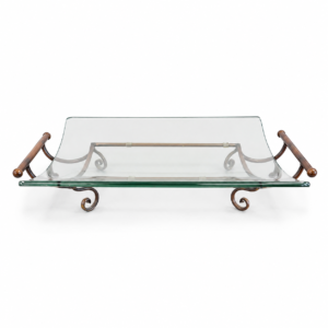 Rectangular clear glass serving tray with curved edges, warm wood handles, and decorative metal frame.
