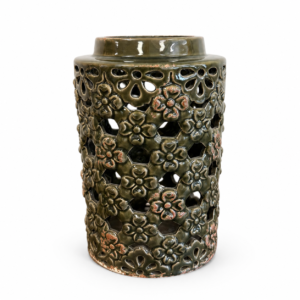 Olive green ceramic lantern with raised floral details, decorative cutouts, and distressed accents