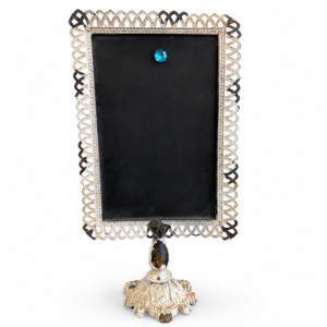 Vintage-style black memo board with distressed cream metal frame, decorative pedestal base, and ornate detailing.
