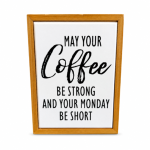 Framed farmhouse wood sign reading “May Your Coffee Be Strong and Your Monday Be Short” with black lettering and natural wood frame.