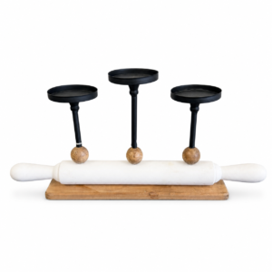 Decorative rolling pin candle holder with three black metal candle platforms, white rolling pin, and natural wood accents.